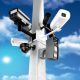 Surveillance mega camera's concept with a sky background